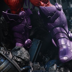 May include: Close-up of a purple robotic leg armor with intricate details. The armor has a metallic sheen and is set against a backdrop of dark, rocky terrain and mechanical components. The design suggests a futuristic or science fiction theme.