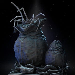 May include: A detailed sculpture of a dark, alien egg sac with a smaller egg beside it. The larger sac has a textured surface and a spidery appendage on top. The background is a dark space with stars.