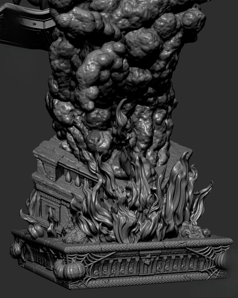 May include: A grayscale sculpture depicting a burning building with flames and smoke. The base features carved pumpkins and spiderwebs. The detailed artwork shows a house engulfed in fire, with billowing smoke rising above.