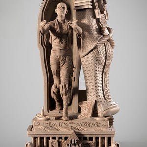 May include: A detailed, beige-colored sculpture of a mummy emerging from a sarcophagus, next to a pharaoh figure. The base features hieroglyphs and the text "THE MUMMY" and "Oh!Amon-Ra--Ok! God of Gods".