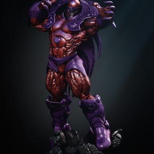 May include: A detailed statue of a muscular figure in a purple and red armored suit, posed with arms raised. The figure stands on a rocky base, with a dark background. The statue has a helmet and cape.