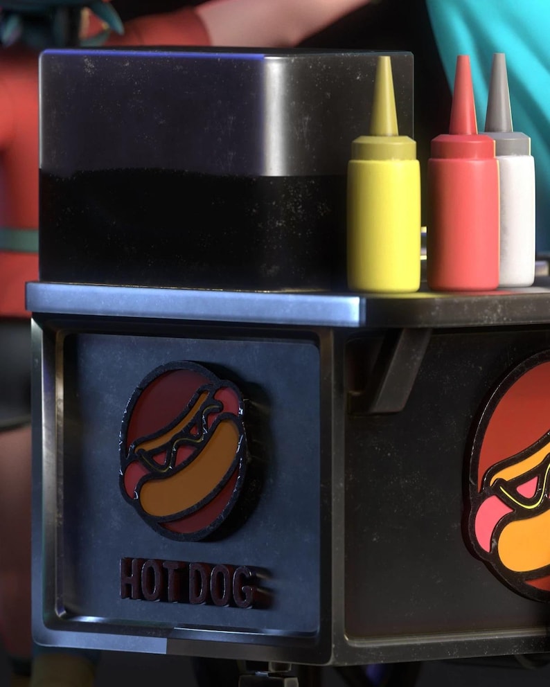 May include: A black hot dog cart with a red, yellow, and white condiment bottles. The cart has a circular logo with a hot dog and the words "HOT DOG" in red letters.