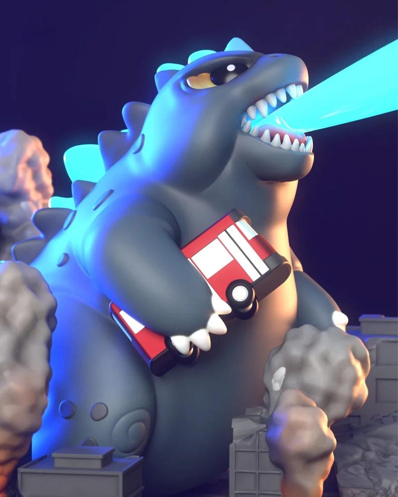 May include: A cartoon Godzilla figure in grey, holding a red and white toy fire engine. The figure is emitting a blue beam from its mouth. The background features stylized smoke and city buildings.