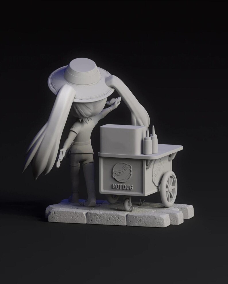 May include: A 3D-rendered figurine of a person wearing a hat, standing next to a hot dog cart. The cart has the word "HOTDOG" printed on it. The figurine is on a stone base, with a dark background.