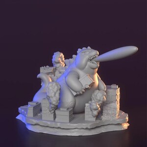 May include: A 3D-printed sculpture of a cartoon monster with a long tongue, destroying a city. The monster is holding a building and is surrounded by stylized buildings and smoke clouds. The sculpture is in a neutral colour.