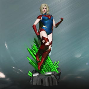 May include: A figurine of a female superhero in a blue and red costume, standing on a green crystal formation. The figure has blonde hair and a determined expression. The costume features a red cape and the iconic "S" emblem.