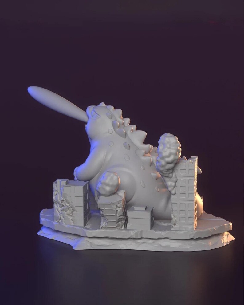 May include: A grey 3D-printed sculpture of a monster destroying a city. The monster has a long tongue and spiky back. Buildings are crumbling, with smoke rising. The sculpture is on a grey base.
