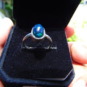 May include: A handmade wooden sign displaying the word "Welcome" in a handwritten font. The white-painted sign has a distressed finish and a floral design. Suitable for indoor or outdoor use, it adds a welcoming touch.