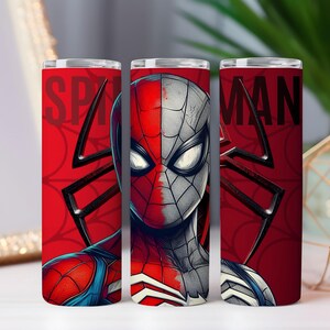 May include: A red and black Spider-Man themed tumbler. The tumbler features the Spider-Man character's face split down the middle, with the words "SPIDER MAN" on the sides. The background includes a black spider web design.