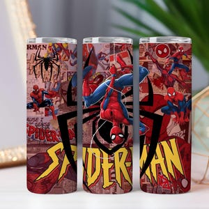 May include: Three stainless steel tumblers with a Spider-Man comic book design. The design features Spider-Man in action poses, comic book panels, and the words "Spider-Man" in yellow and red. The background is a collage of red and brown.