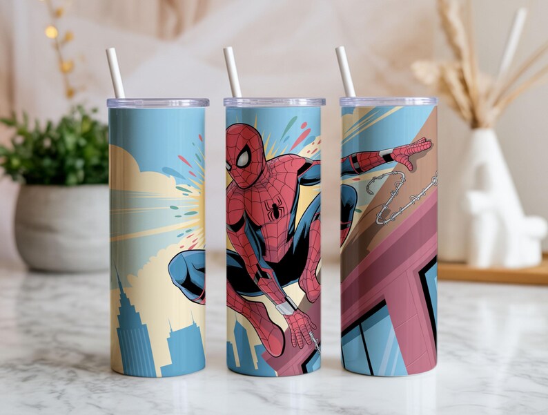 May include: Three stainless steel tumblers with Spiderman graphics. Each tumbler features a different Spiderman design, with a blue background and a white straw. The designs include Spiderman in action, cityscapes, and web-slinging.