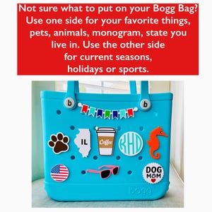 May include: A turquoise Bogg Bag adorned with charms such as a paw print, Illinois outline, coffee cup, monogram, seahorse, sunglasses, American flag, and a "Dog Mom" badge. The bag features a banner of colourful flags and the text: "Not sure what to put on your Bogg Bag?"