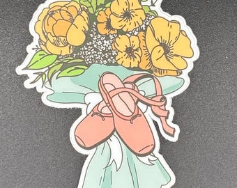 May include: A sticker featuring a bouquet of yellow flowers with green leaves and a pair of pink ballet slippers tied with a ribbon. The bouquet is wrapped in a light blue paper.
