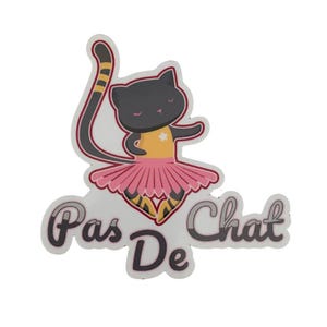 May include: A black cat wearing a pink tutu and a yellow shirt with a star dances on a white background. The text "Pas De Chat" is written in a stylized font below the cat.