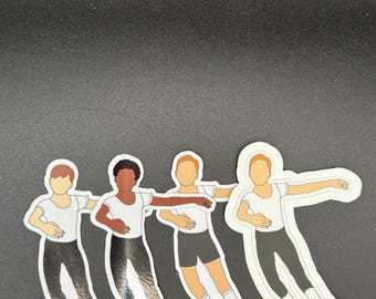 May include: Four stickers of ballet dancers in various skin tones. Each dancer wears a white short-sleeved shirt, black pants or shorts, and ballet shoes. The stickers are outlined in white and appear to be die-cut.