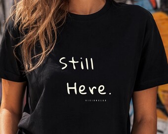 Still Here T-Shirt | Motivational Statement Tee | Creative Mindset Shirt | Minimal Typography Shirt | Inspirational Streetwear
