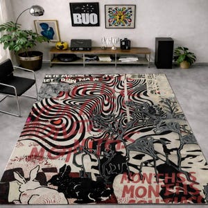 May include: A large rug with a striking abstract design in black, white, and red. The rug features swirling patterns, text, and illustrations of rabbits and other figures. The overall aesthetic is modern and artistic.
