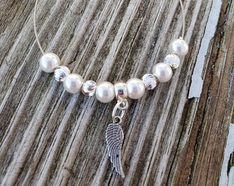 Guitar String Bracelet with White Crystal Pearls & Angel Wing Charm