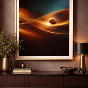 May include: Framed art print depicting a coffee bean floating in a swirling abstract design of warm orange and gold hues against a dark backdrop. The artwork hangs above a dark wood cabinet with a gold lamp and decorative items.
