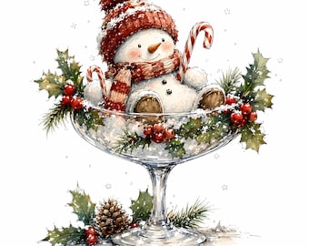 May include: A watercolour illustration of a snowman wearing a red and white striped knit hat and scarf, sitting inside a glass bowl filled with holly leaves, red berries, and a candy cane. The text Santa Prints is visible at the top.