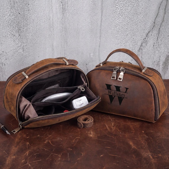 Full-grain leather cable organizer that makes tangled charger chaos look like a gentleman's kit — personalized monogramming elevates it from functional to giftable.