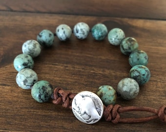 African Turquoise single wrap gemstone bracelet with a silver buffalo clasp