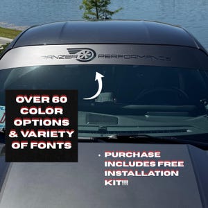 May include: A matte black windshield banner decal applied to the top of a car windshield, featuring the text PANZER PERFORMANCE with a stylized turbine logo. The image includes text stating OVER 60 COLOR OPTIONS & VARIETY OF FONTS and PURCHASE INCLUDES FREE INSTALLATION KIT!!!