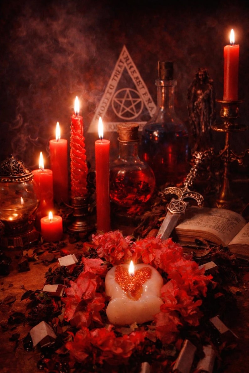 May include: A mystical scene featuring lit red candles of varying sizes, a heart-shaped candle, and a decorative dagger. The composition includes potion bottles, an open book, and a pentagram symbol, all set against a dark, atmospheric backdrop.
