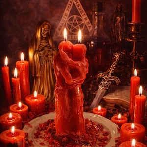 May include: A mystical scene featuring numerous red candles of varying sizes, some with heart-shaped cutouts. A central candle shaped like embracing figures is the focal point, surrounded by other occult items.