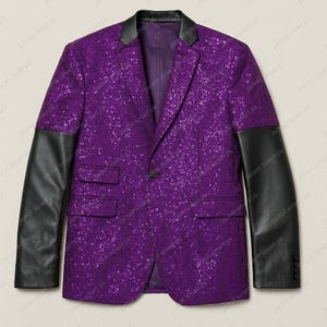 May include: A purple sequined blazer with black leather sleeves and a black collar. The blazer has a single-button closure and two front pockets. The jacket is a stylish piece of outerwear.