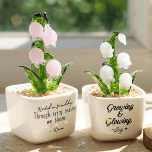 May include: A set of three ceramic mugs with a speckled, matte finish. The mugs are in shades of cream, light gray, and dark gray. Each mug has a simple, minimalist design and a rounded handle. The mugs are suitable for coffee, tea, or other beverages.
