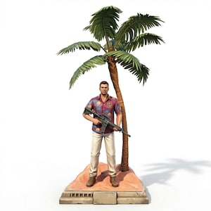 May include: A figurine of a man in a colourful shirt and khaki trousers, holding a rifle, standing next to a palm tree. The figurine is on a small, sandy base with a concrete-like border. The man has short brown hair.