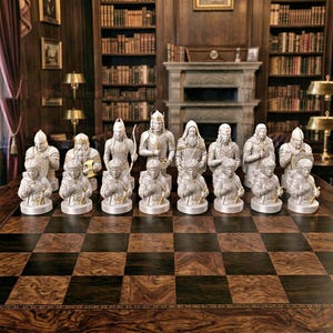 A split-screen promotional banner for a Mythic Fantasy Chess Set STL collection. The top shows a row of finely crafted, white and gold character busts (Light faction: King, elves, dwarf). The bottom shows a row of dark, menacing, and intricate character busts (Dark faction: armored figures, ghouls). The center features a gothic-style title banner that reads: 'MYTHIC FANTASY CHESS SET STL'. The background shows a library and a dark fortress.