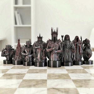 A split-screen promotional banner for a Mythic Fantasy Chess Set STL collection. The top shows a row of finely crafted, white and gold character busts (Light faction: King, elves, dwarf). The bottom shows a row of dark, menacing, and intricate character busts (Dark faction: armored figures, ghouls). The center features a gothic-style title banner that reads: 'MYTHIC FANTASY CHESS SET STL'. The background shows a library and a dark fortress.
