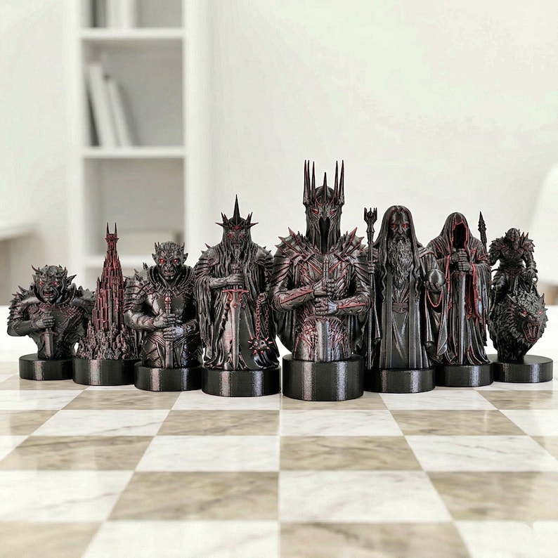 A split-screen promotional banner for a Mythic Fantasy Chess Set STL collection. The top shows a row of finely crafted, white and gold character busts (Light faction: King, elves, dwarf). The bottom shows a row of dark, menacing, and intricate character busts (Dark faction: armored figures, ghouls). The center features a gothic-style title banner that reads: 'MYTHIC FANTASY CHESS SET STL'. The background shows a library and a dark fortress.
