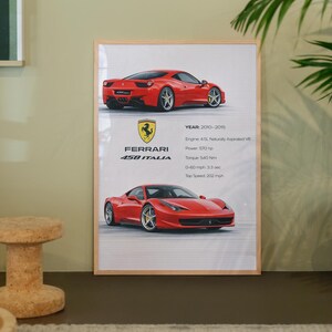 May include: A framed print showcasing a red Ferrari 458 Italia. The print details the car's specifications, including engine type, power, torque, and a top speed of 325 km/h. The Ferrari logo is displayed prominently.