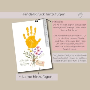 May include: A white rectangular print featuring a yellow handprint above a bouquet of colourful flowers. A ruler is visible on the right side, showing a measurement of 11.7 cm. The text reads Alles Liebe zum Geburtstag and Luca.