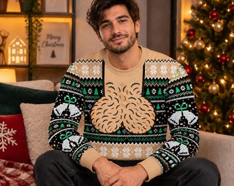 May include: A long-sleeve crew neck jumper featuring a tan base colour with a black and green holiday-themed pattern. The design includes white bells, green pine trees, and snowflake motifs, with a large tan graphic of two rounded shapes.