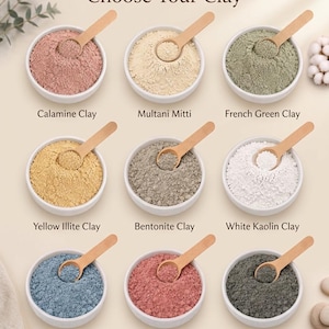 May include: An assortment of nine different clay powders in white bowls, each with a wooden spoon. The text "Choose Your Clay" is at the top. The clays are labeled: Calamine, Multani Mitti, French Green, Yellow Illite, Bentonite, White Kaolin, Blue, Rose, and Dead Sea.