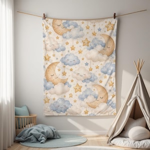 May include: A rectangular fabric wall hanging featuring a repeating pattern of smiling crescent moons in tan, fluffy clouds in shades of blue and cream, and hanging gold stars. The design is printed on a light cream background.