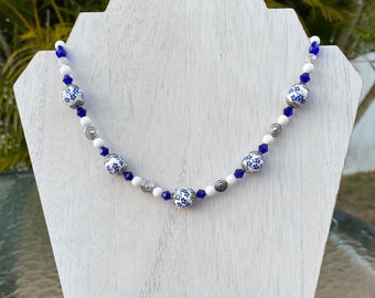 Necklace: Cobalt Blue and White Floral Beaded Choker with Silver, White, and Cobalt Blue Beads and a Bright Silver Magnetic Clasp