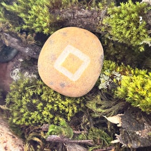 May include: A rustic wooden sign with the text "Welcome to our home" in white lettering. The sign features a distressed finish and a simple, inviting design, perfect for entryway decor.