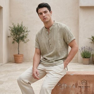 Mens khaki linen shirt styled for beach outfit, relaxed fit short sleeve summer top