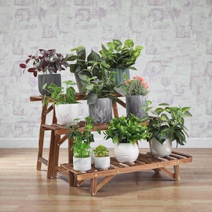 May include: A three-tiered wooden plant stand with several potted plants. The plants are in decorative pots of various colours and patterns, including grey, white, and green. The stand is made of dark brown wood and is against a patterned wall.
