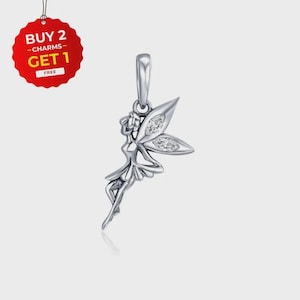 May include: A silver fairy charm with sparkling details on the wings, designed for a necklace or bracelet. The charm depicts a fairy in a flowing dress. A red tag with the text "BUY 2 CHARMS GET 1 FREE" is in the upper left corner.