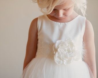 The Handmade to Measure Sorrel Flower Girl Dress in white and Ivory with a Full Tulle Skirt and Lace Sash