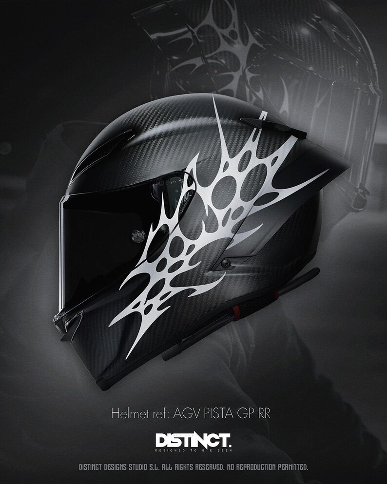 May include: Black motorcycle helmet with a carbon fiber weave pattern and a white abstract design. The helmet has a visor and is labeled "AGV PISTA GP RR" with the "DISTINCT" logo.