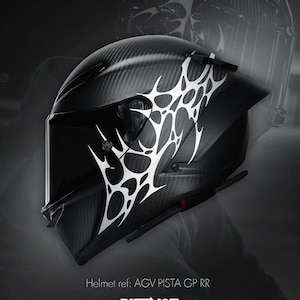 May include: Black motorcycle helmet with a carbon fiber weave pattern and white abstract design. The helmet has a visor and is labeled "AGV PISTA GP RR" with the "DISTINCT" logo.