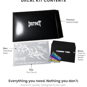 May include: Decal kit contents, including a black folder and envelope, a tribal decal sheet, visor decal, and metallic stickers. The word "DISTINCT" is printed on the folder, decal sheet, and stickers. The text "THANK YOU" is on the envelope.