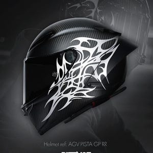 May include: A black motorcycle helmet with a carbon fiber weave pattern and a white tribal design. The helmet has a dark visor and the text "DISTINCT" is visible. The helmet is a AGV PISTA GP RR model.